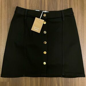 NWT Reformation Jeans black denim skirt with gold metal buttons, size 4